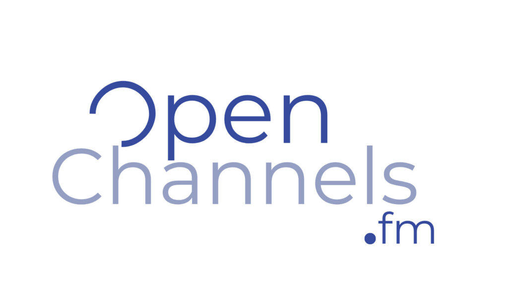 Logo for Open Channels .fm with the word Open in dark blue and Channels in light blue. The O in Open is stylized, and .fm appears in dark blue at the bottom right.