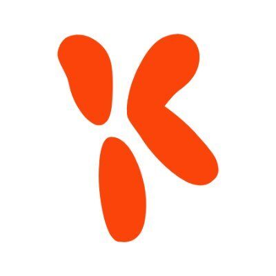 An abstract orange shape on a white background, resembling four rounded, irregular blobs arranged to form the letter K.